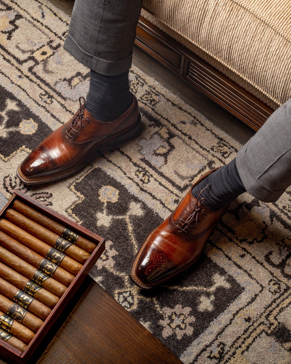 Man wearing brown leather brogue shoes with natural creases