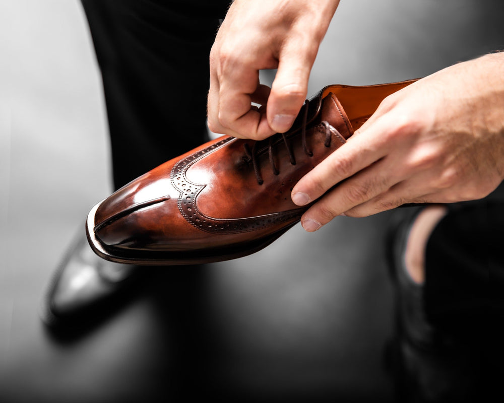 Brown leather shoe included in a men’s capsule wardrobe