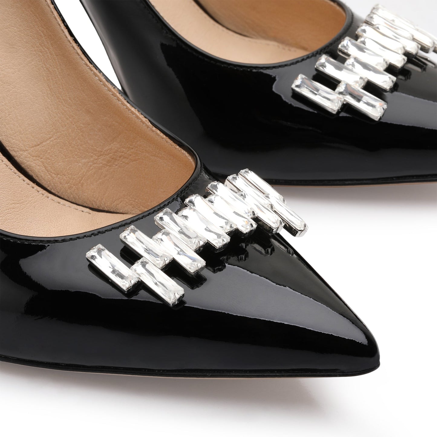 Black pumps with a brooch